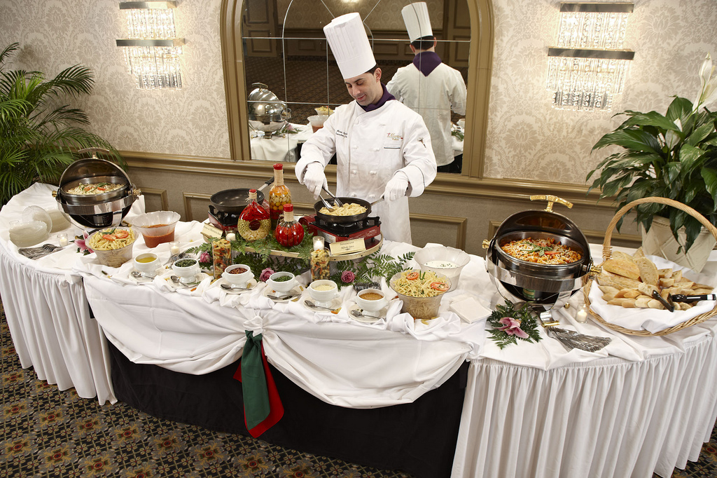 Chef preparing food at live station Toronto